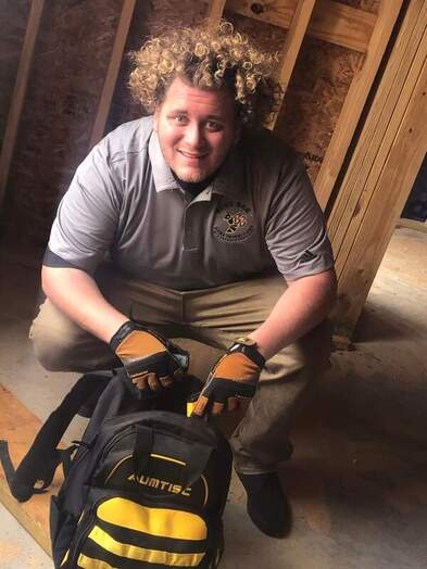 Home Inspector getting advanced tools from tool bag